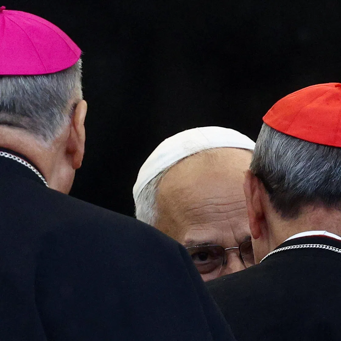Pope Leo XIV greets a bishop and a cardinal, on the day he holds a general audience in St. Peter's Square at the Vatican, September 10, 2025. REUTERS/Guglielmo Mangiapane/File Photo