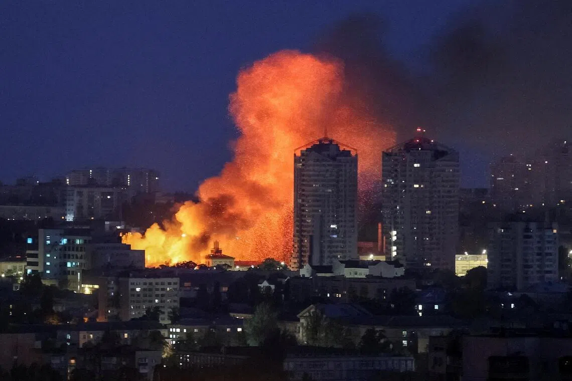 Fire and smoke rise in the aftermath of a Russian drone strike in Kyiv.
