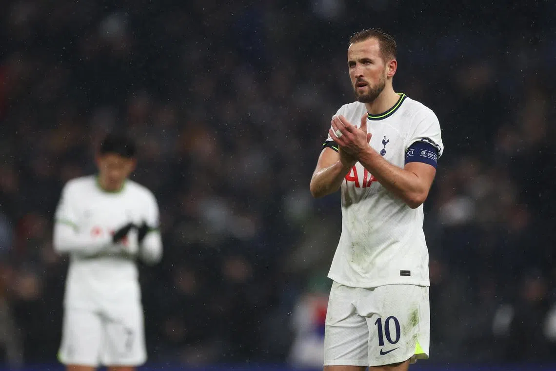 Dejected Tottenham striker Harry Kane applauds fans after the match.