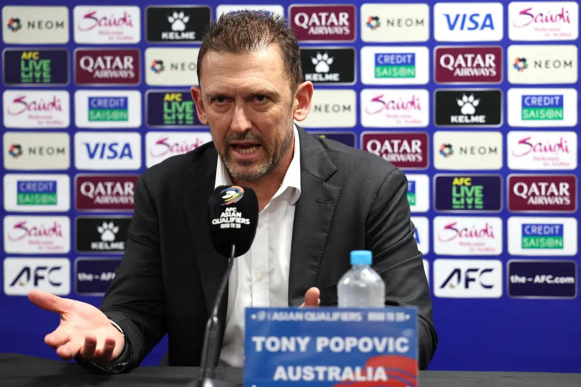 FILE PHOTO: Soccer Football - World Cup - AFC Qualifiers - Third Round - Group C - Australia v Indonesia - Post-match Press Conference - Allianz Stadium, Sydney, Australia - March 20, 2025 Australia's Tony Popovic during the press conference after the match REUTERS/Hollie Adams/File Photo