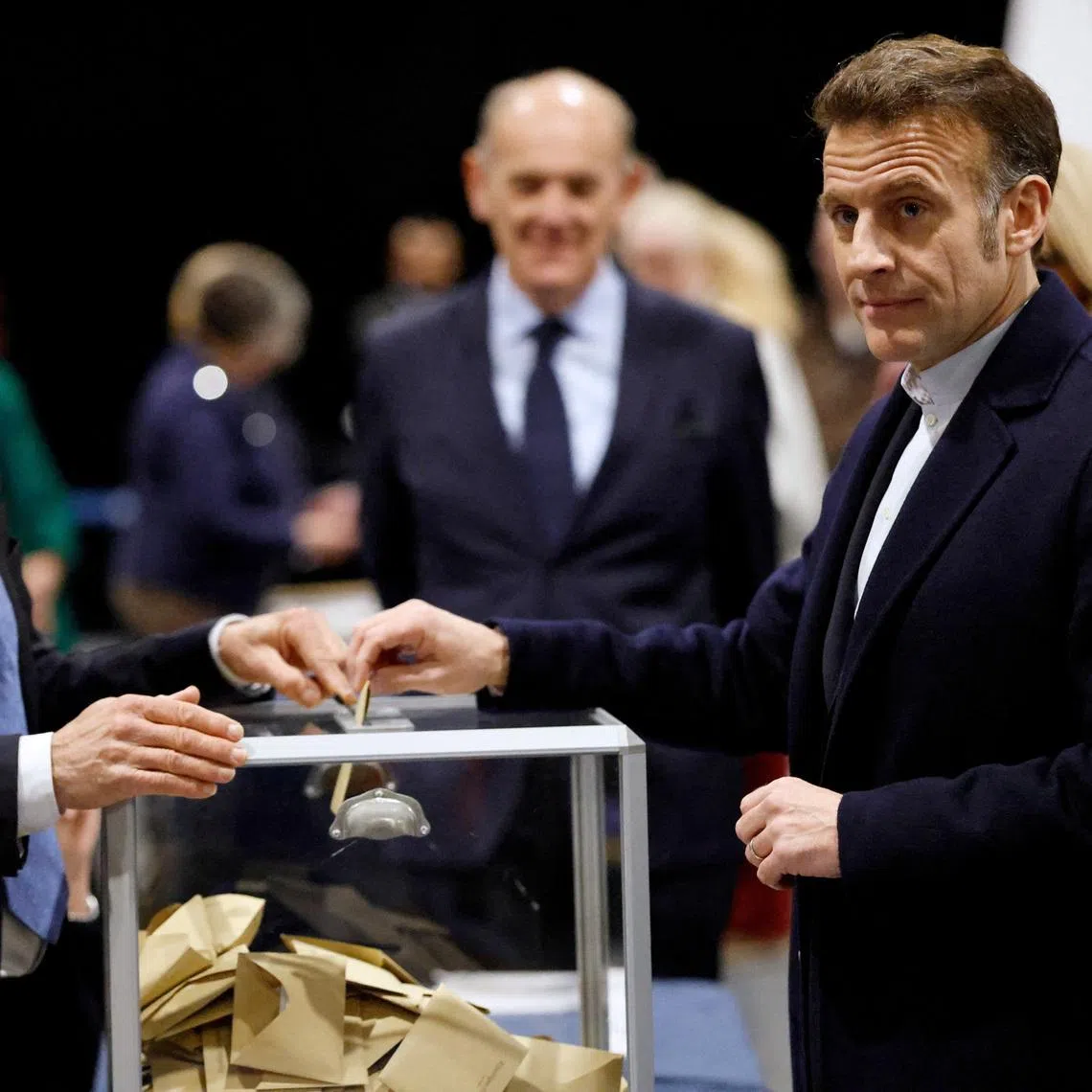 French President Emmanuel Macron casts a ballot on the day of the first round of France's municipal elections in Le Touquet-Paris-Plage, France, Sunday, March 15, 2026. Jean-Francois Badias/Pool via REUTERS