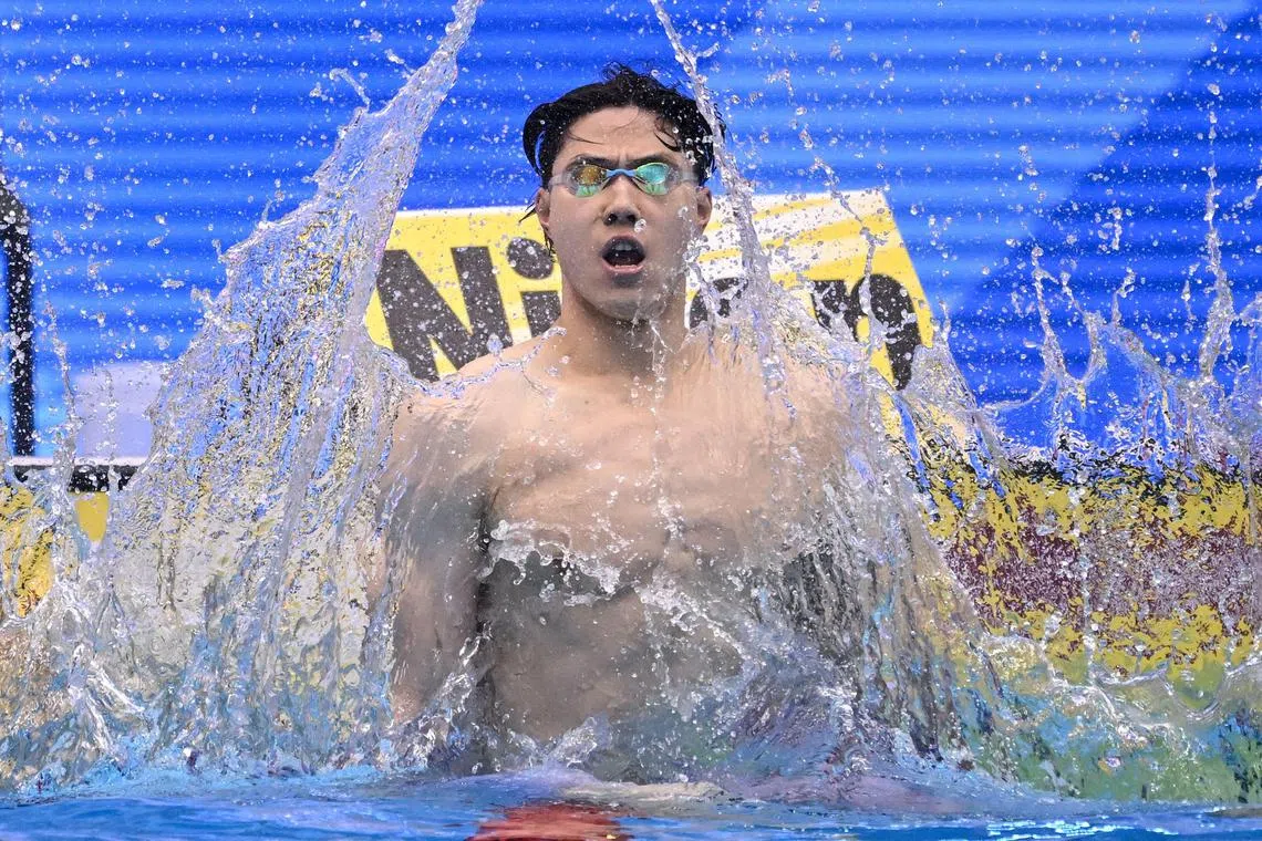 China's Qin Haiyang celebrates after victory in the final of the men's 200m breaststroke swimming event during the World Aquatics Championships in Fukuoka on July 28, 2023. (Photo by Philip FONG / AFP)