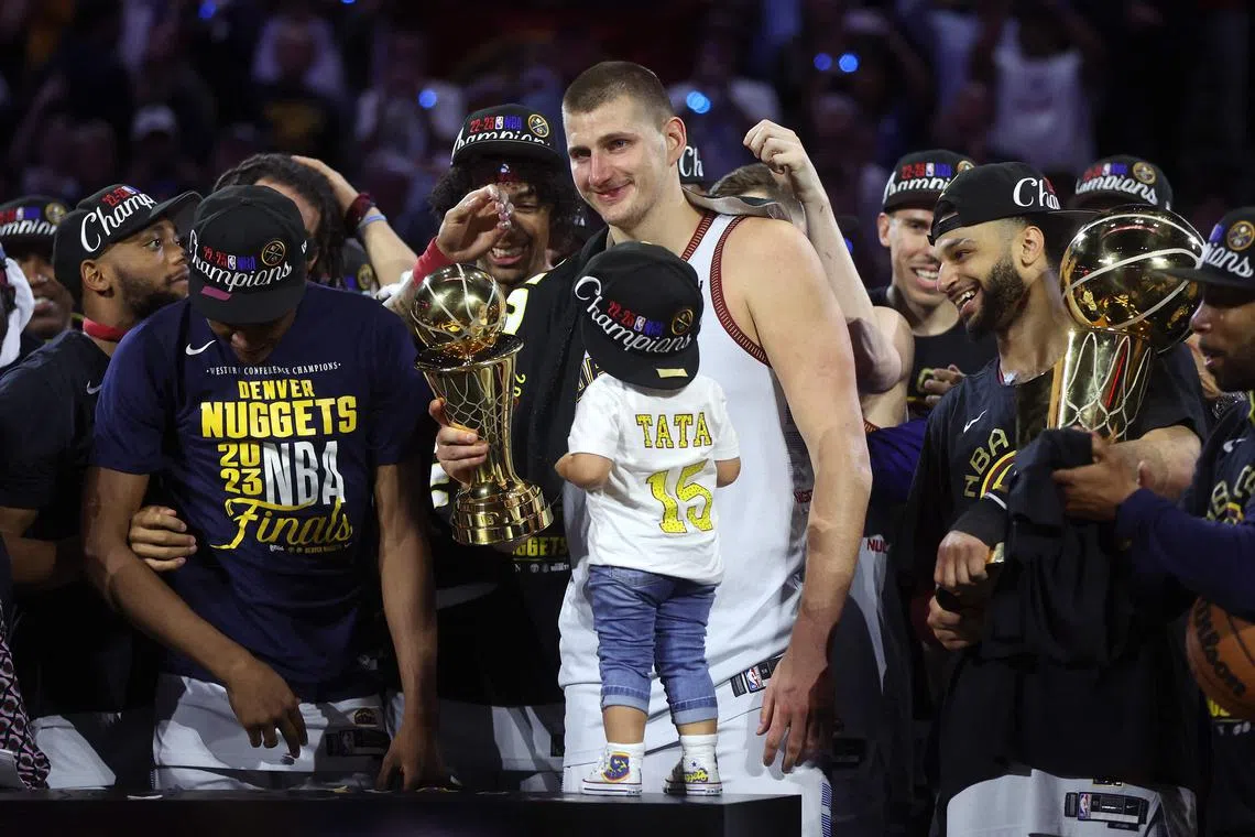 DENVER, COLORADO - JUNE 12: Nikola Jokic #15 of the Denver Nuggets celebrates with the Bill Russell NBA Finals Most Valuable Player Award after a 94-89 victory against the Miami Heat in Game Five of the 2023 NBA Finals to win the NBA Championship at Ball Arena on June 12, 2023 in Denver, Colorado. NOTE TO USER: User expressly acknowledges and agrees that, by downloading and or using this photograph, User is consenting to the terms and conditions of the Getty Images License Agreement.   Matthew Stockman/Getty Images/AFP (Photo by MATTHEW STOCKMAN / GETTY IMAGES NORTH AMERICA / Getty Images via AFP)
