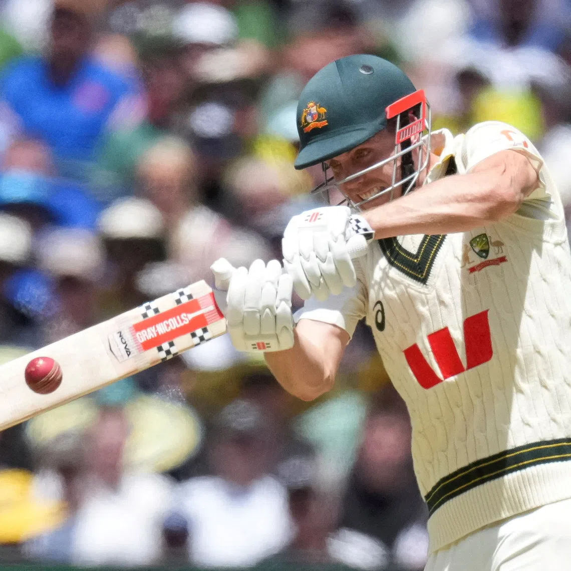 FILE PHOTO: Cricket - The Ashes - Australia v England - Fourth Test -  MCG, Melbourne, Australia - December 26, 2025 Australia's Cameron Green batting plays a shot for four runs against bowler England's Josh Tongue.    REUTERS/Asanka Brendon Ratnayake/File Photo