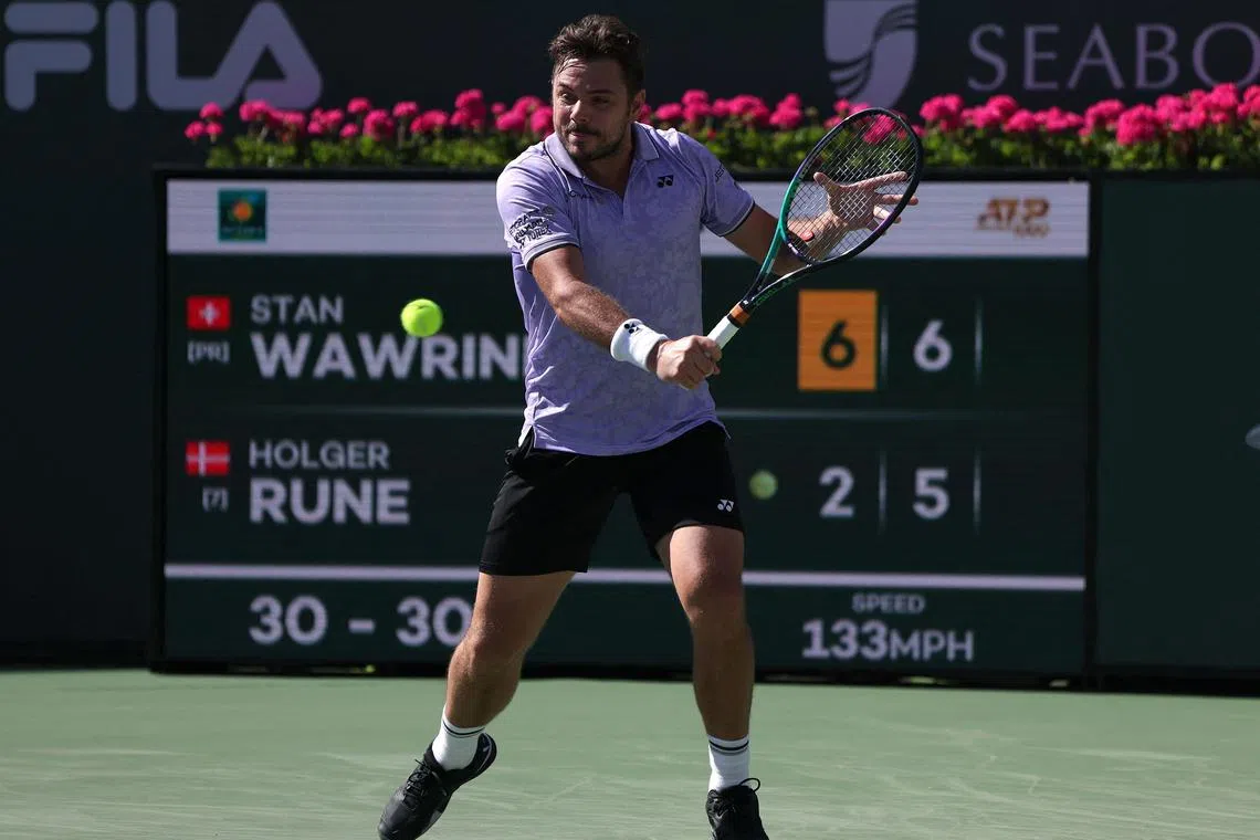 Stan Wawrinka of Switzerland returning a backahand in his three-set win over Holger Rune of Denmark during the BNP Parisbas Open at Indian Wells.
