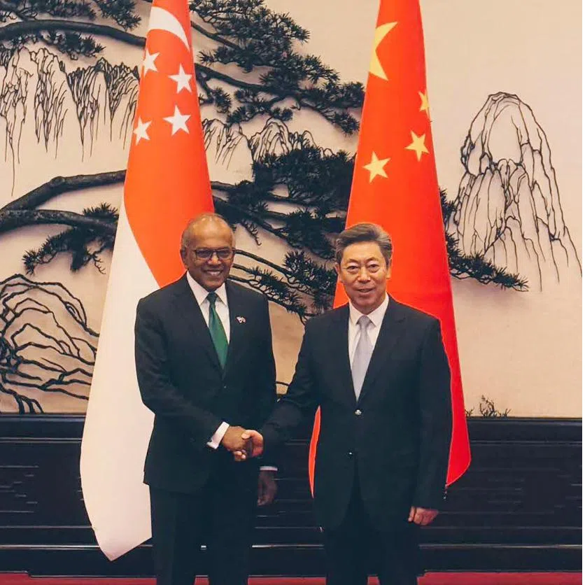 Coordinating Minister for National Security K. Shanmugam with Chinese State Councillor and Minister of Public Security Wang Xiaohong (left pic, right) and Secretary of the Central Political and Legal Affairs Commission Chen Wenqing.