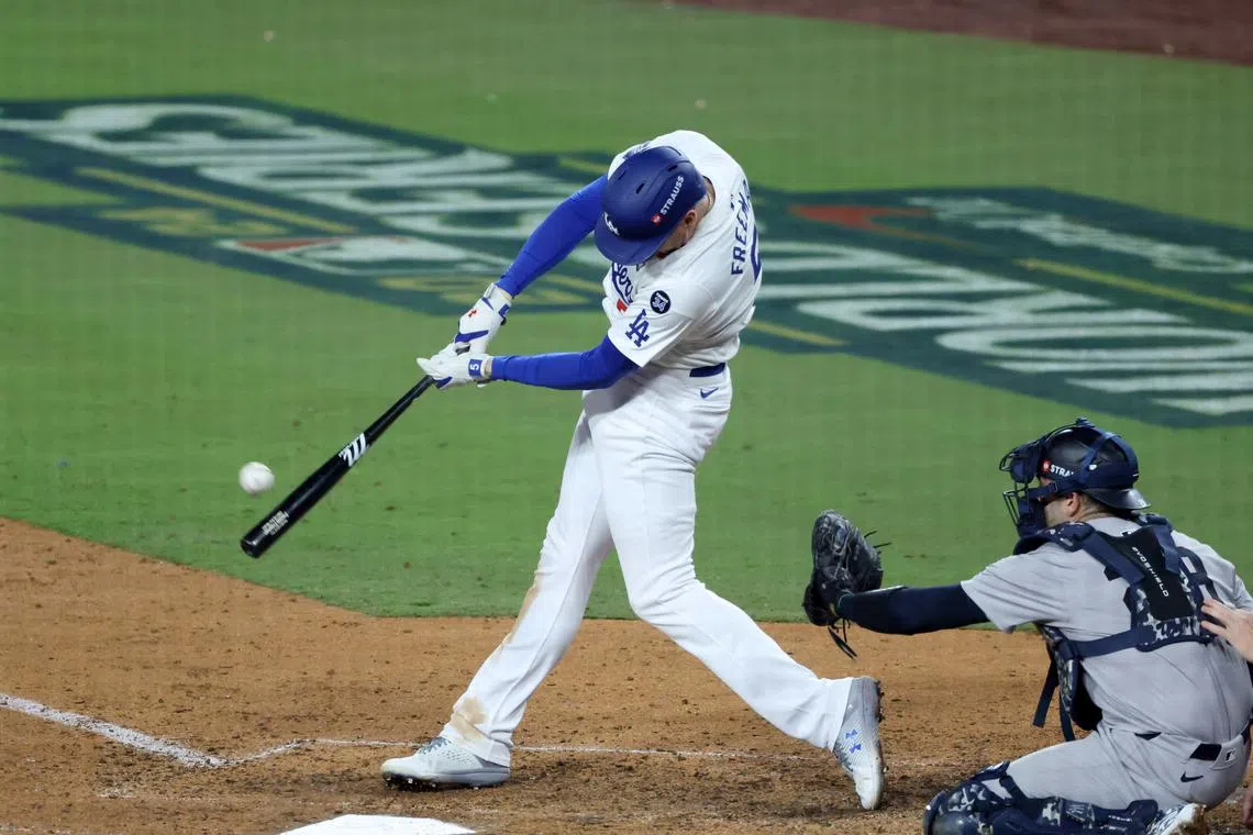 Oct 25, 2024; Los Angeles, California, USA; Los Angeles Dodgers first baseman Freddie Freeman (5) hits a grand slam home run in the tenth inning against the New York Yankees during game one of the 2024 MLB World Series at Dodger Stadium. Mandatory Credit: Kiyoshi Mio-Imagn Images/File Photo