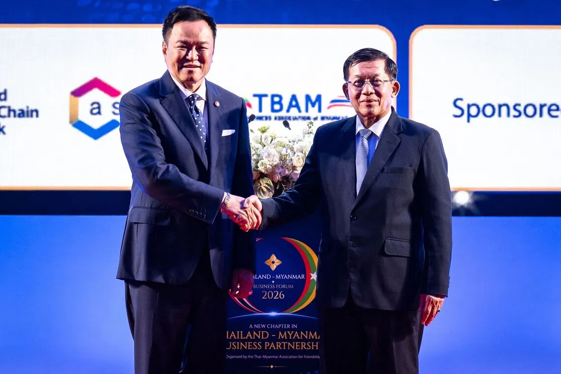 Thailand’s Prime Minister Anutin Charnvirakul (left) and Myanmar’s President Min Aung Hlaing shake hands during the Thailand-Myanmar Business Forum 2026 at the Queen Sirikit National Convention Center in Bangkok on Aug 6.