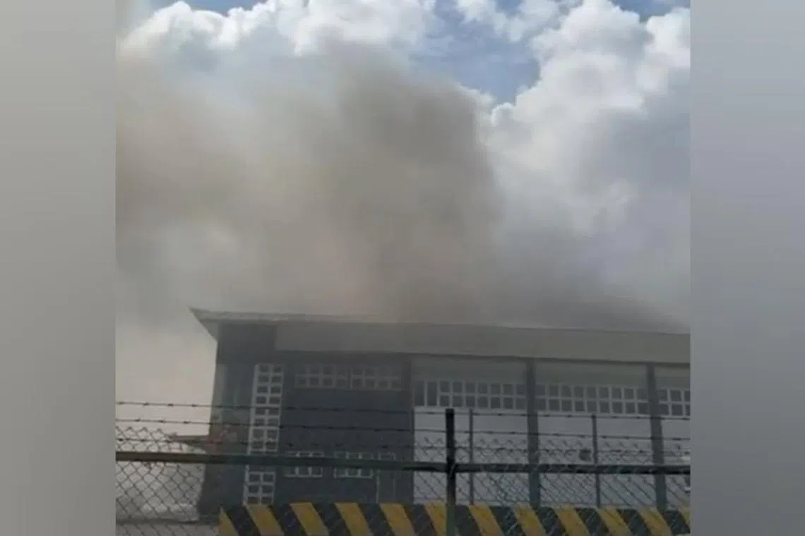 Smoke emitting from the second floor of a two-storey industrial building at Fishery Port Road on June 28, 2024.