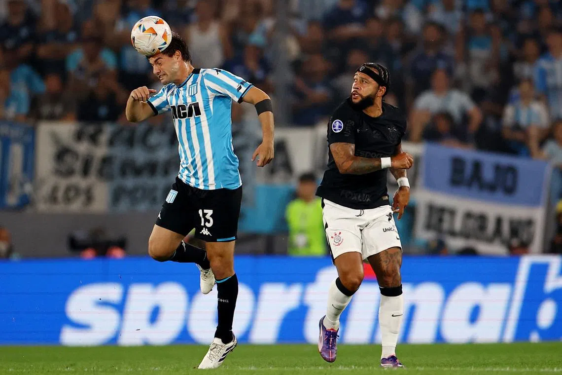 Soccer Football - Copa Sudamericana - Semi Final - Second Leg - Racing Club v Corinthians - Estadio Presidente Peron, Avellaneda, Argentina - October 31, 2024 Racing Club's Santiago Sosa in action with Corinthians' Memphis Depay REUTERS/Agustin Marcarian/File Photo