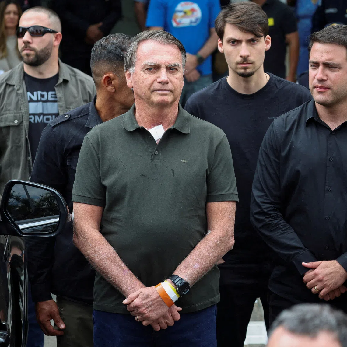 FILE PHOTO: Former Brazilian President Jair Bolsonaro leaves the hospital where he went to undergo a skin surgery procedure, authorized by Supreme Court Justice Alexandre de Moraes, leaving the house arrest after being convicted by a Supreme Court majority of plotting a coup to remain in power after losing the 2022 election, in Brasilia, Brazil, September 14, 2025. REUTERS/Adriano Machado/ File Photo