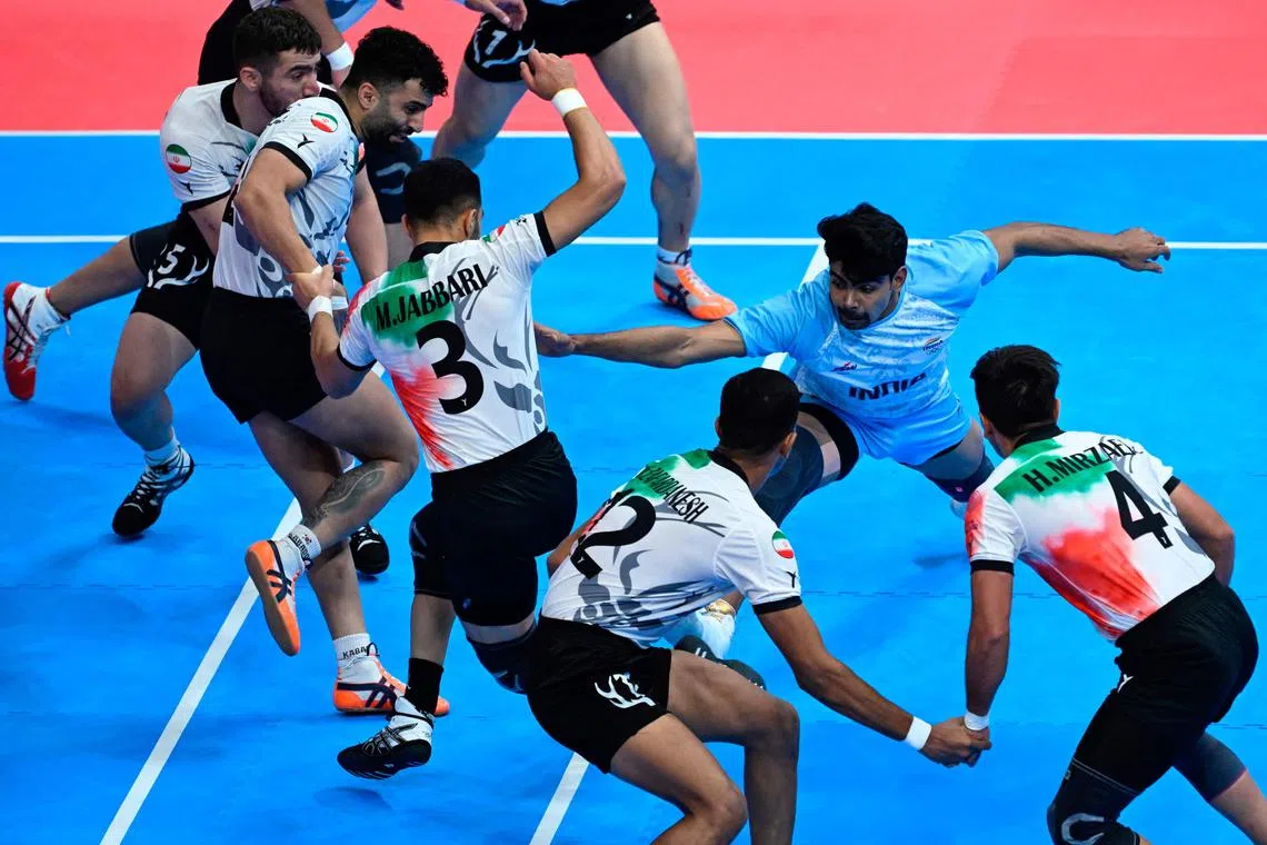 India’s Pawan Kumar (in blue) competing in the men's kabaddi gold medal match between India and Iran during the Hangzhou 2022 Asian Games in Hangzhou, China, on Oct 7.