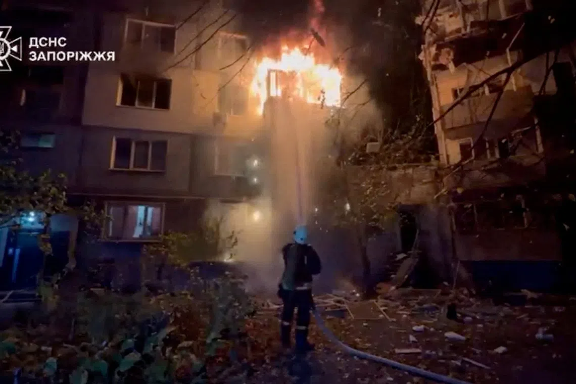 A firefighter works at the site of a Russian strike, amid Russia's attack on Ukraine.