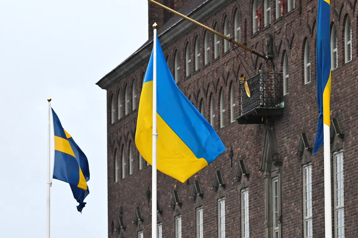 The flag of Ukraine waves in the wind at City Hall, in Stockholm, Sweden February 24, 2022. TT News Agency/Claudio Breskiani via REUTERS