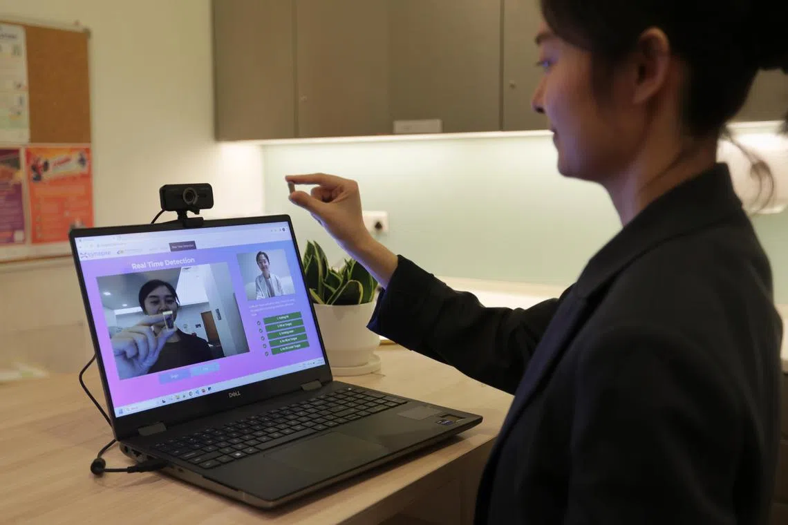ST20230721_202359321890: Gin Tay / jtihis27/ Joyce Teo/

*Embargoed till July 27, 2023*

Synapaxe Data Scientist, Jenny Zou, demostrating the future of patient care with AV-MED's AI-driven medication adherence tech on July 21, 2023.
