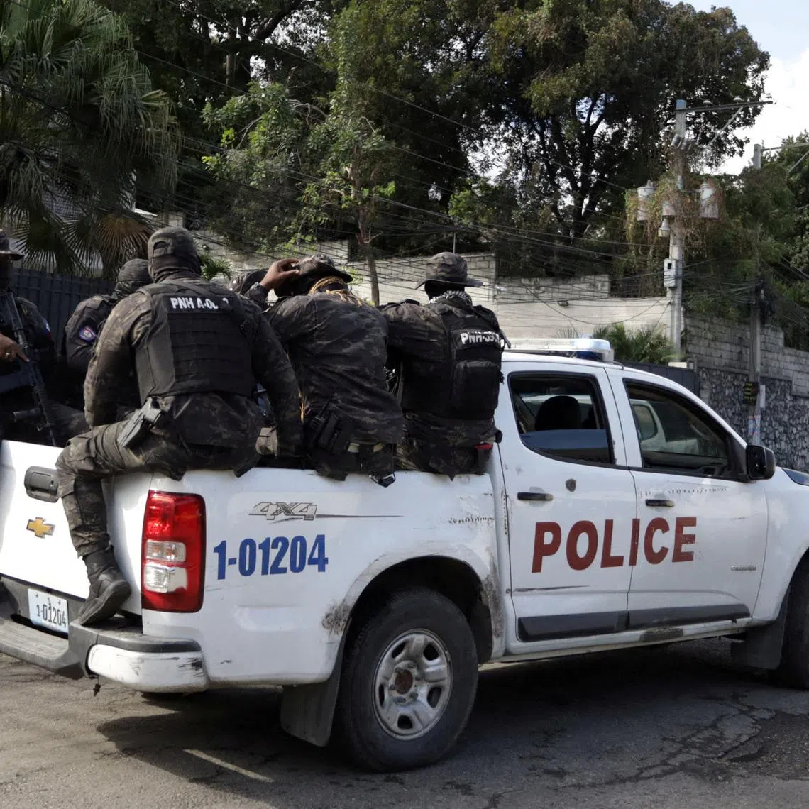 FILE PHOTO: Haitian security forces partrol the Prime Minister's office  and the headquarters of the Transitional Presidential Council (CPT), as the mandate of the transitional governing council, formed to curb gang violence and pave the way for long-delayed election, is set to end on February 7 with no succession plan in place, in Port-au-Prince, Haiti, February 6, 2026. REUTERS/Egeder Pq Fildor/File Photo