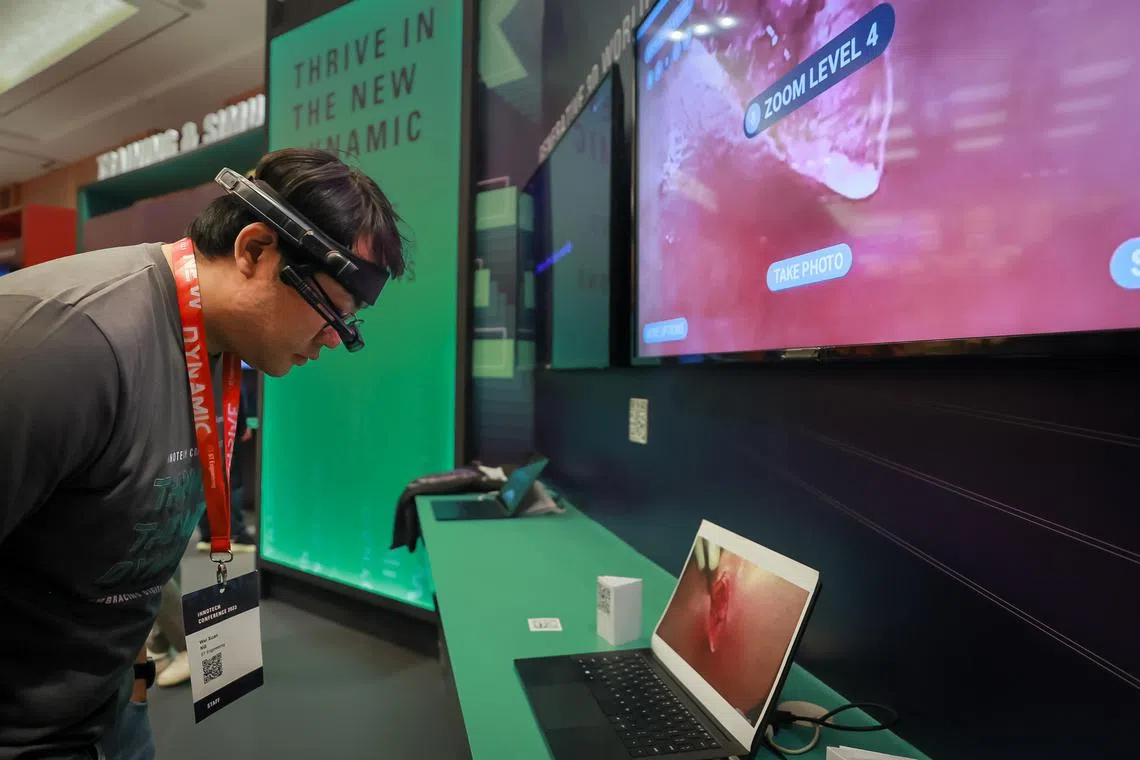 ST Engineering’s video headset for nurses to use to stream footage of patients to doctors if they are away being demonstrated at the ST Engineering InnoTech Conference held at the Sands Expo and Convention Centre, Sep 5, 2023.