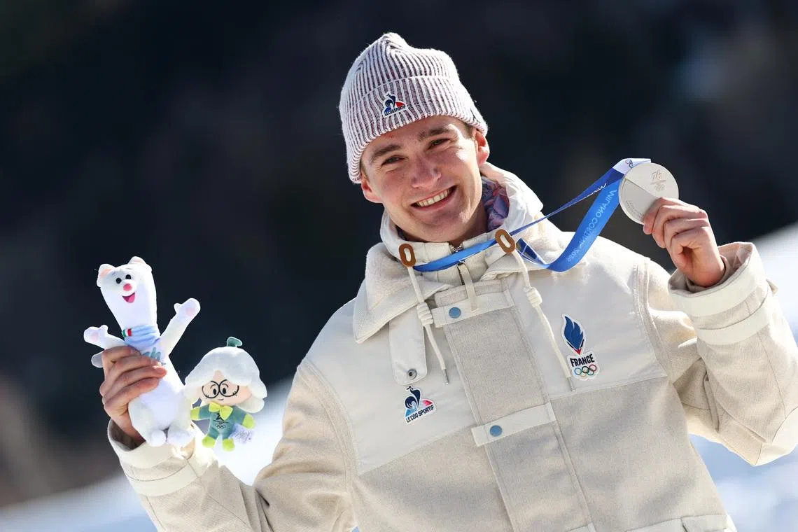 Milano Cortina 2026 Olympics - Cross-Country Skiing - Men's 10km + 10km Skiathlon Victory Ceremony - Tesero Cross-Country Skiing Stadium, Lago, Italy - February 08, 2026. Silver medallist Mathis Desloges of France celebrates on the podium REUTERS/Kai Pfaffenbach