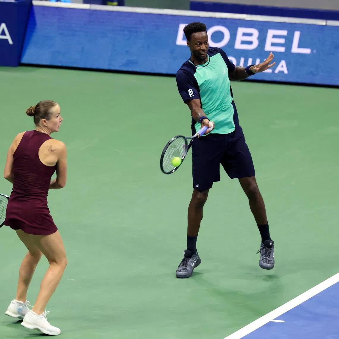 France’s Gael Monfils (right) and Ukraine’s Elina Svitolina in action during a mixed doubles match at the US Open in New York on Aug 26.