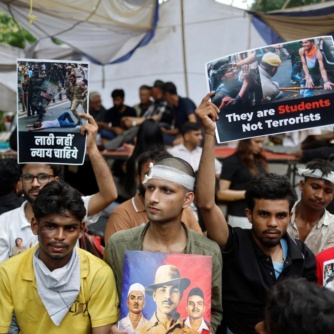 Injured supporters of India’s Cockroach Janta Party at a protest site in Jantar Mantar in New Delhi on July 21.