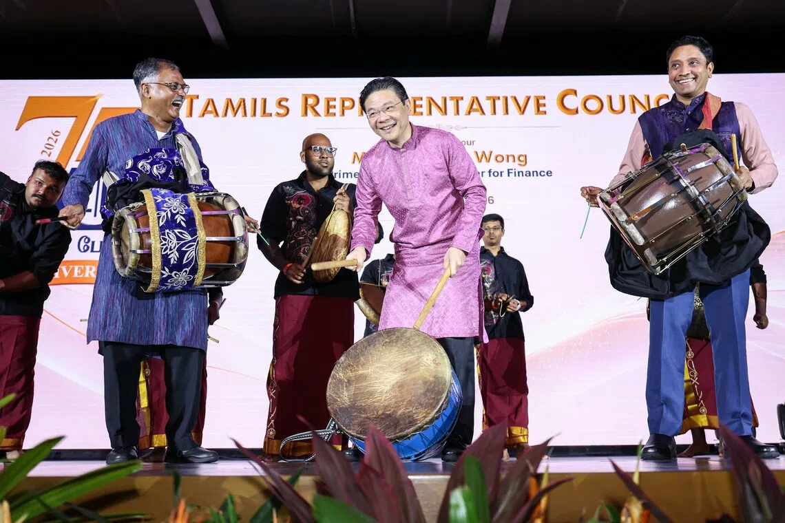 Prime Minister Lawrence Wong (centre) with Senior Minister of State for Transport Murali Pillai (left) and Minister of State for Culture, Community and Youth Dinesh Vasu Dash at the Tamils Representative Council’s 75th anniversary gala dinner on Sept 19.