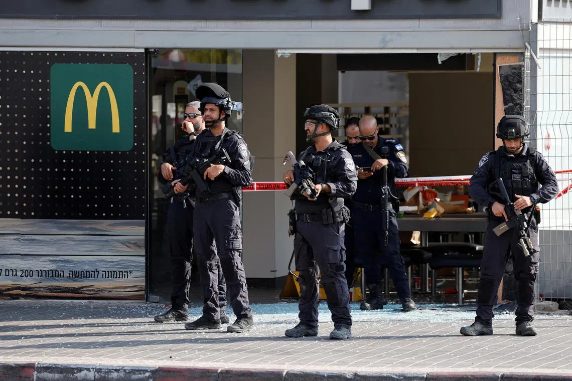 Israeli police secure the scene of a “suspected terrorist attack” in the southern Israeli city of Beersheba.