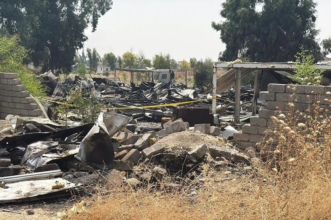 Damage at a site belonging to Iraq's Popular Mobilization Forces (PMF) following airstrikes that the PMF said were carried out by U.S. and Saudi forces, in Bartella, Nineveh province, Iraq, July 29, 2026.  Picture taken with a mobile phone. REUTERS/Khalid Al-Mousily