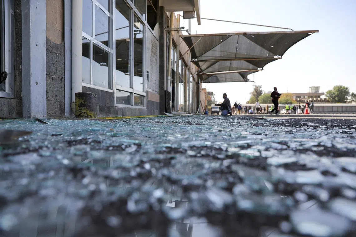 Shattered glass lies on the ground near damaged buildings of Sanaa Airport, following an Israeli airstrike on Dec 27.