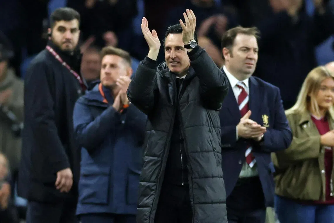 Aston Villa manager Unai Emery applauds fans on the pitch after the English Premier League match against Liverpool at Villa Park.