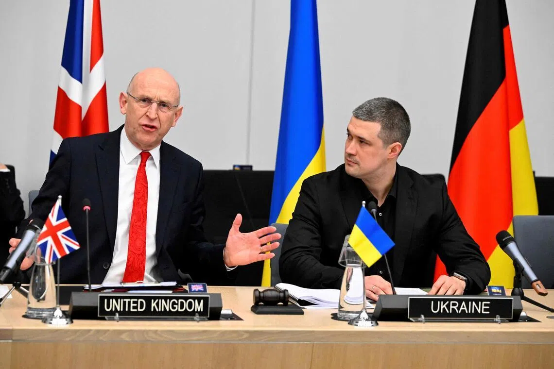 British Defence Secretary John Healey (left) addressing the media at a defence ministers' meeting at NATO's headquarters in Brussels on Feb 12, with his Ukrainian counterpart, Mr Mykhailo Fedorov.