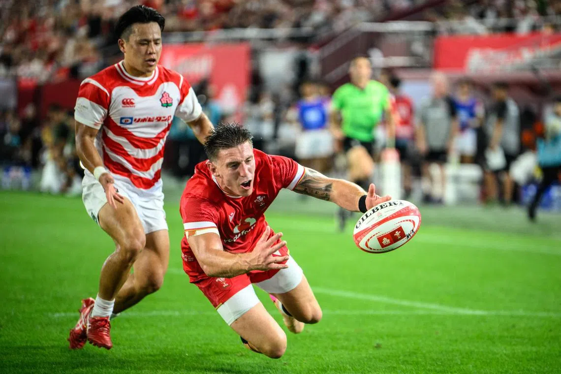 Wales' Josh Adams tries to catch the ball during the international rugby union Test match against Japan in July 2025.