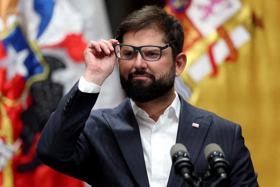 FILE PHOTO: Chilean President Gabriel Boric listens to a question at La Moneda government house in Santiago, Chile, March 8, 2024. REUTERS/Ivan Alvarado/File Photo