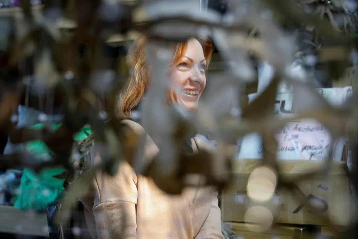 Natalia Yermakova, a volunteer in the \"Family Battalion\" organization producing camouflage netting and assembling food parcels for Russian army needs, and wife of Alexander, who was mobilised to join the country's armed forces involved in the military campaign in Ukraine, speaks during an interview at a workshop in Moscow, Russia, December 7, 2023. REUTERS/Yulia Morozova