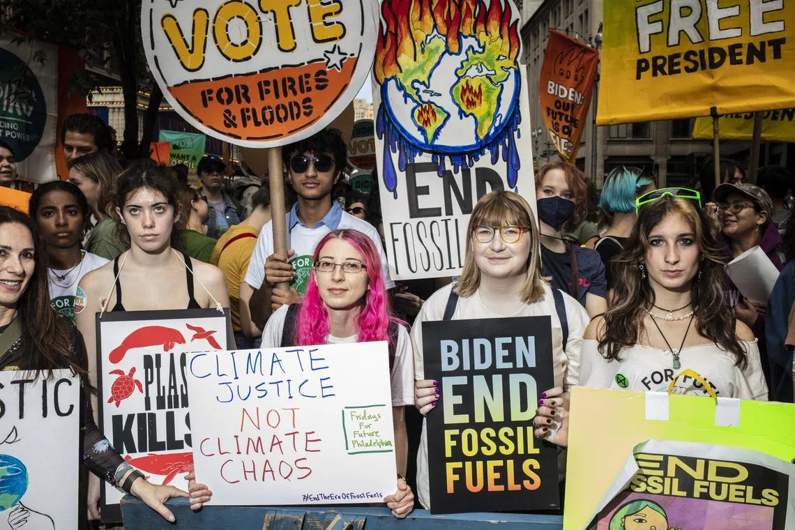 FILE -- Climate demonstrators march to end fossil fuel use, directing much of their ire at President Joe Biden, in New York, Sept. 17, 2023. The tug of war over one drilling lease in the Gulf of Mexico involving the president, Congress and the courts illustrates the limits of executive power. (Bryan Anselm/The New York Times)