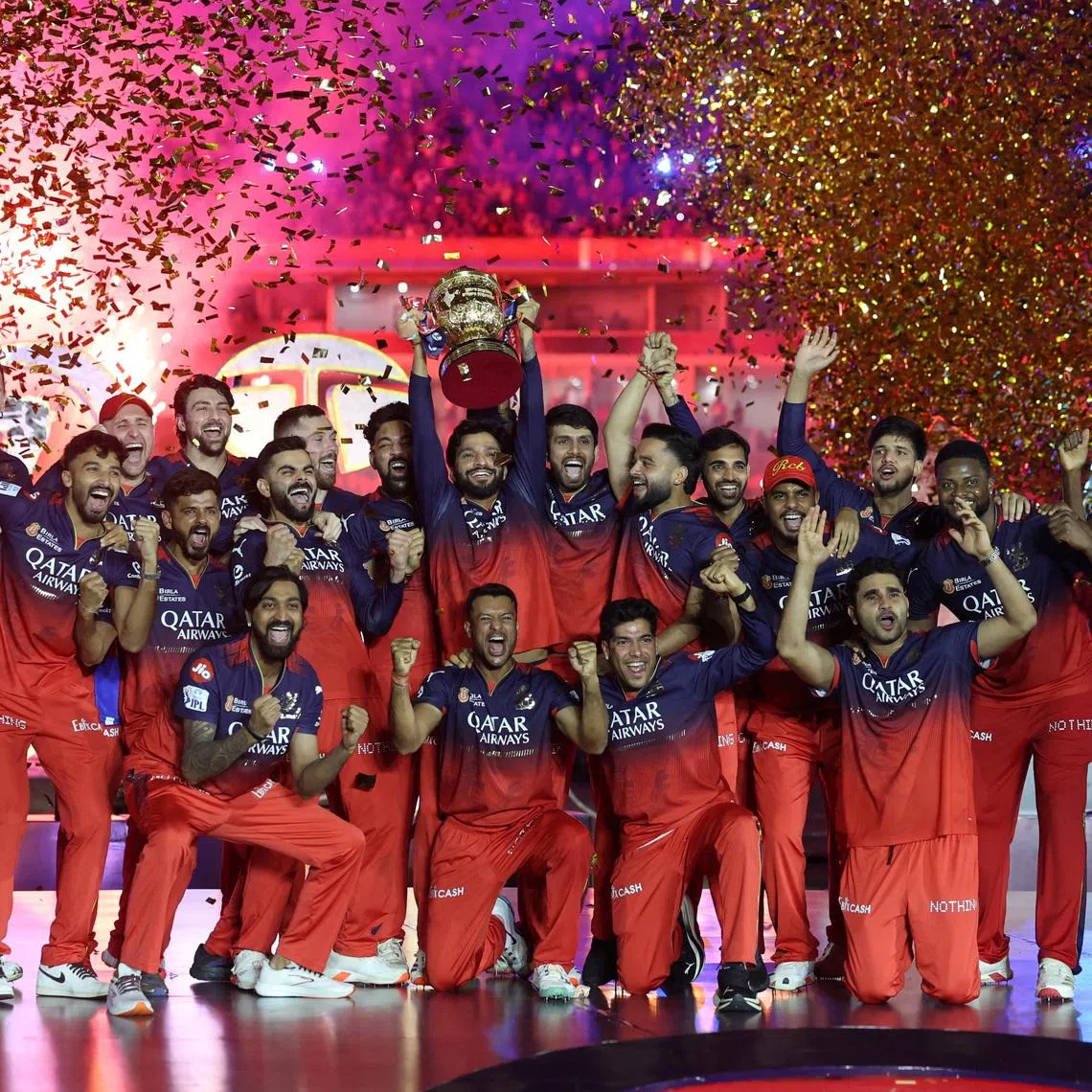 FILE PHOTO: Cricket - Indian Premier League - IPL - Final - Royal Challengers Bengaluru v Punjab Kings - Narendra Modi Stadium, Ahmedabad, India - June 4, 2025 Royal Challengers Bengaluru players celebrate with the trophy after winning the Indian Premier League. REUTERS/Amit Dave/File Photo