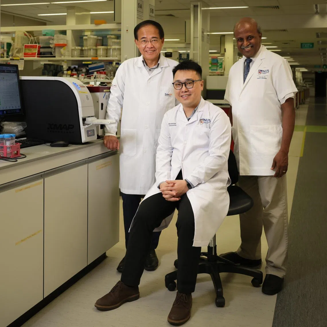 (From right) Professor Paul Tambyah with Dr Tan Chee Wah and Professor Wang Linfa, who both led the team that developed the antibody test.