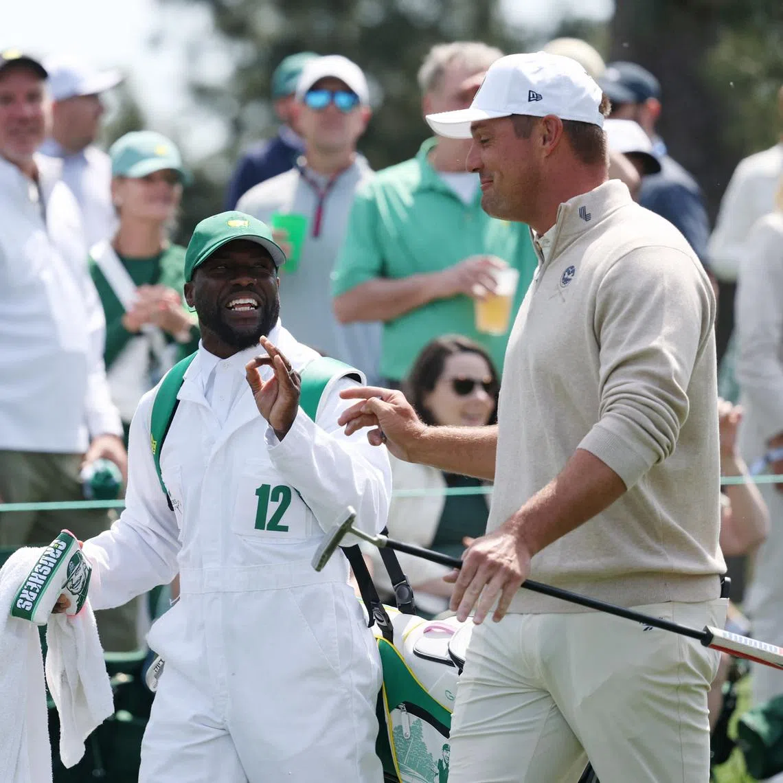 Golf - The Masters - Augusta National Golf Club, Augusta, Georgia, U.S. - April 8, 2026 Bryson DeChambeau of the U.S. with his caddie, actor and comedian Kevin Hart, on the 1st hole during the par 3 contest REUTERS/Mike Segar