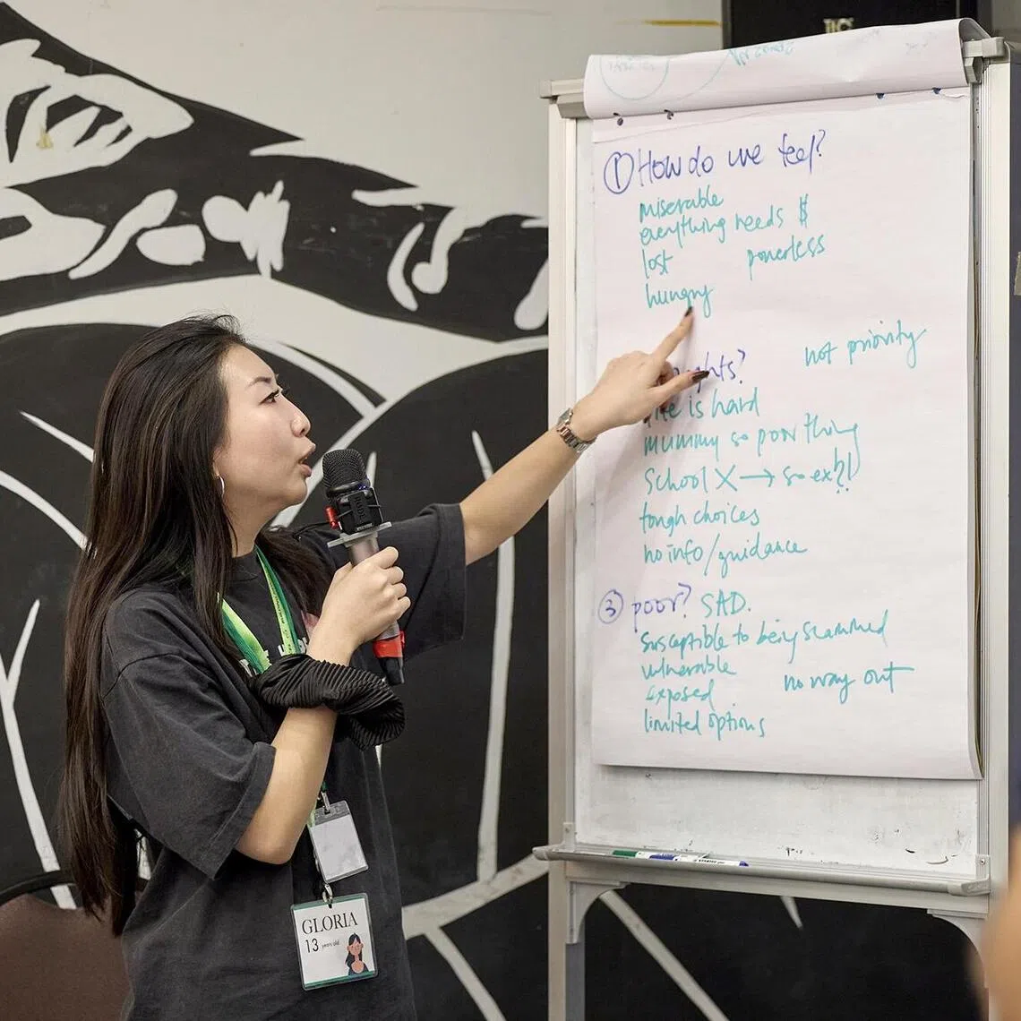 Participants sharing what they learnt or felt after the poverty simulation session.