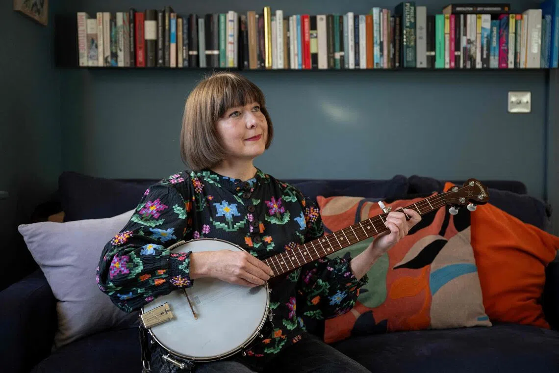 Folk singer Emily Portman, who found a counterfeit potentially AI-generated album purporting to be created by her online, poses for a photograph in Sheffield, northern England, on November 21, 2025. British folk musician Emily Portman was taken by surprise in July when she received a message from a fan congratulating her on her new album — even though she hadn't released one since 2022. That's when she discovered "Orca" in her Spotify and Apple Music catalogues. The titles of the songs were like something she might have created herself, but "very quickly I recognised it was AI-produced music", she said. (Photo by Oli SCARFF / AFP)