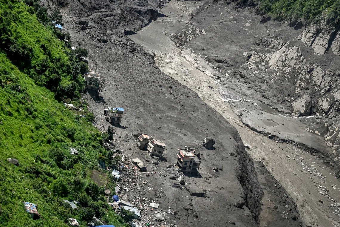 Mother reunited with 8-year-old who climbed trees to survive Nepal floods |  The Straits Times
