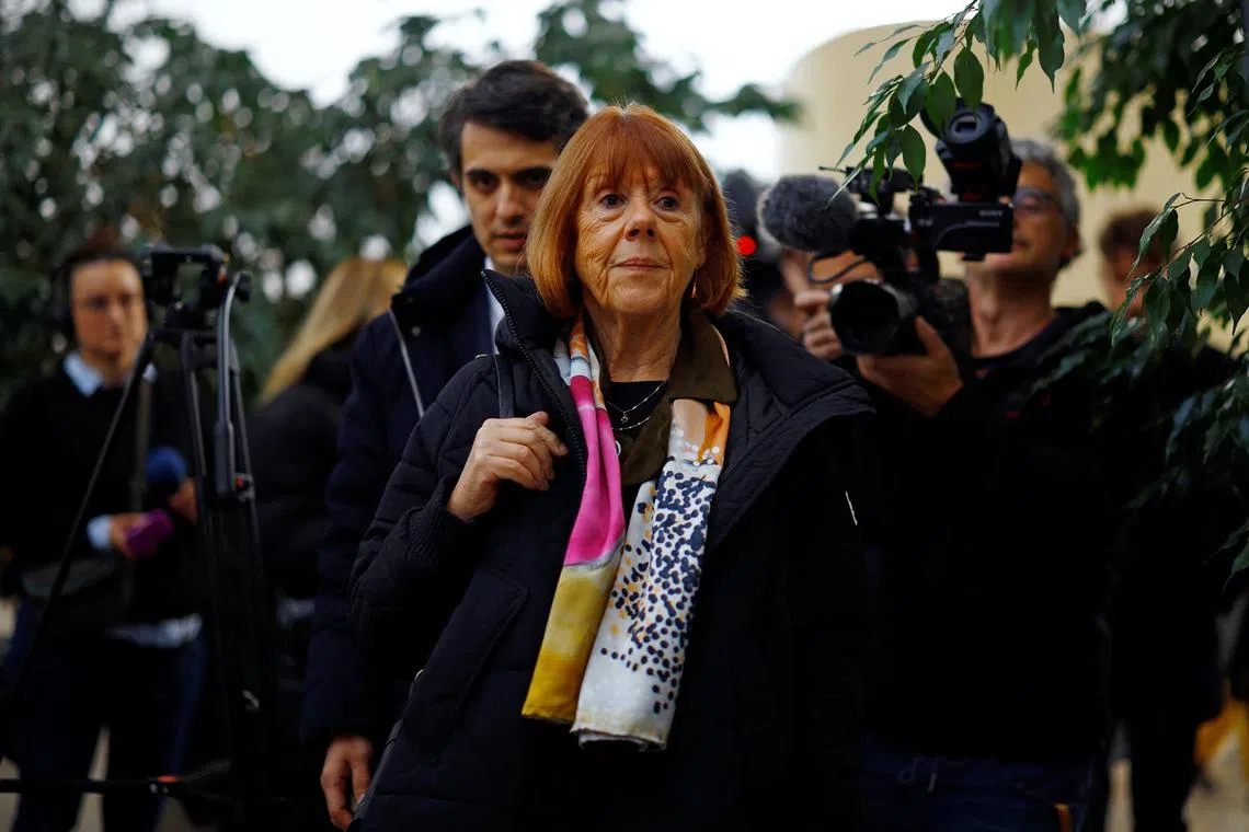 Frenchwoman Gisele Pelicot, the victim of an alleged mass rape orchestrated by her husband Dominique Pelicot at their home in the southern French town of Mazan, is surrounded by journalists as she arrives to attend the trial of Dominique Pelicot with 50 co-accused, at the courthouse in Avignon, France, November 19, 2024. REUTERS/Sarah Meyssonnier