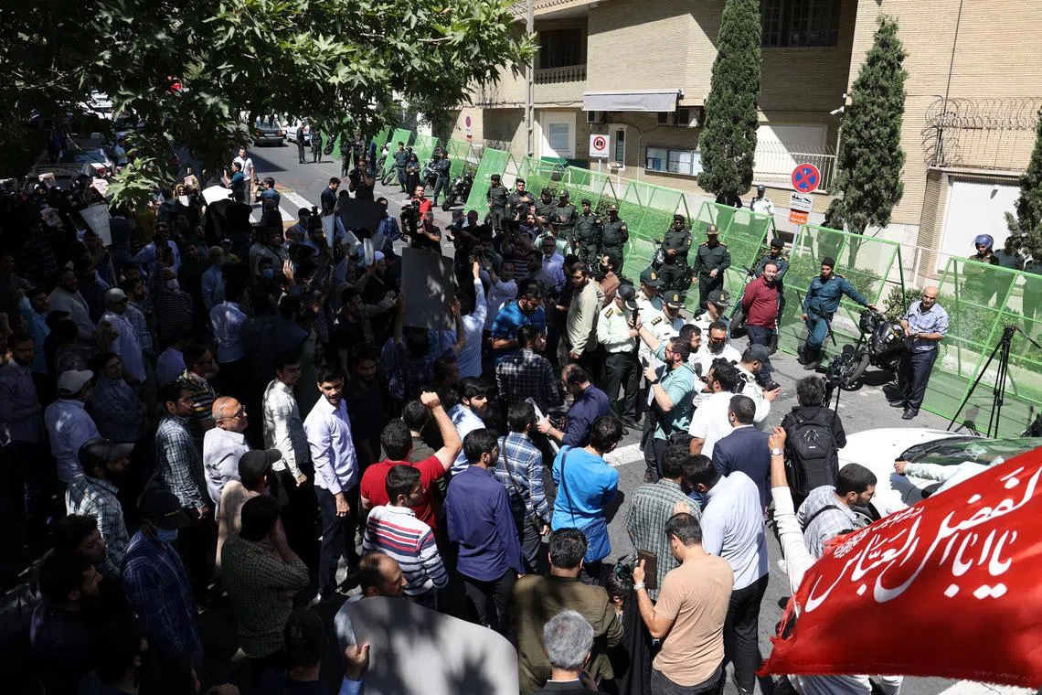 Demonstrators take part in a protest, against a man who burned a copy of the Quran outside a mosque in the Swedish capital Stockholm, in front of the Swedish Embassy in Tehran, Iran June 30, 2023. Majid Asgaripour/WANA (West Asia News Agency) via REUTERS ATTENTION EDITORS - THIS PICTURE WAS PROVIDED BY A THIRD PARTY.