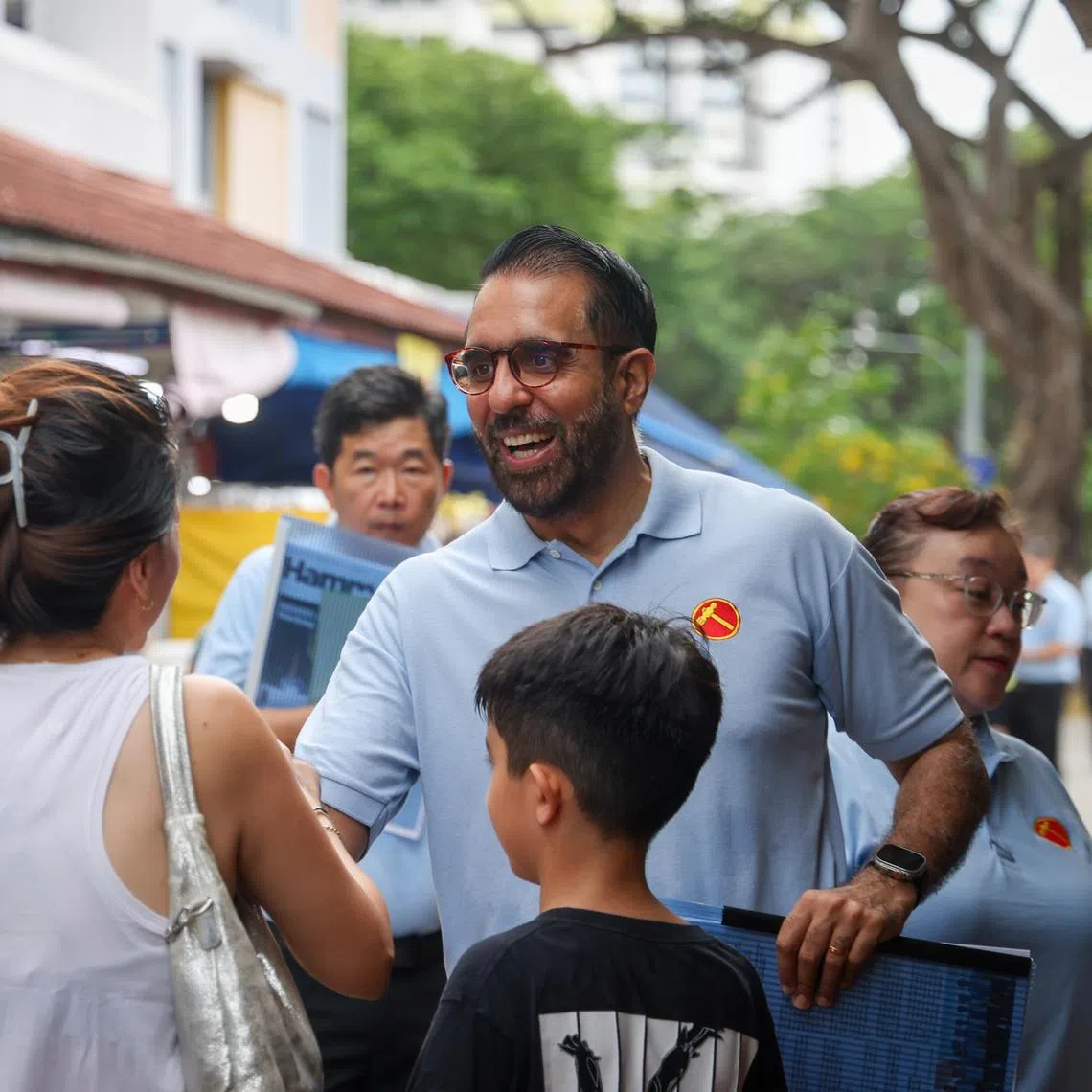 Workers’ Party chief Pritam Singh selling the Hammer newsletter at 85 Fengshan Centre on Apr 12, 2026.