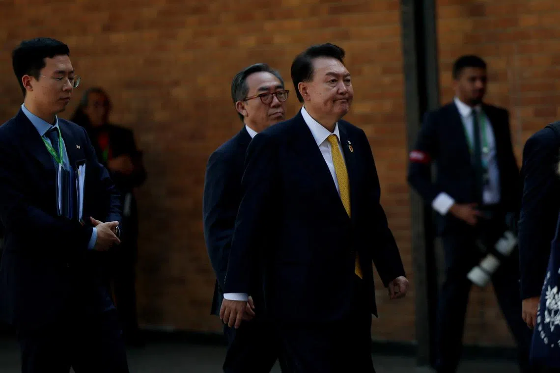 G20 members, including South Korean President Yoon Suk-yeol leave after taking the group photo during the G20 summit at the Museum of Modern Art in Rio de Janeiro, Brazil, November 18, 2024. REUTERS/Leah Millis