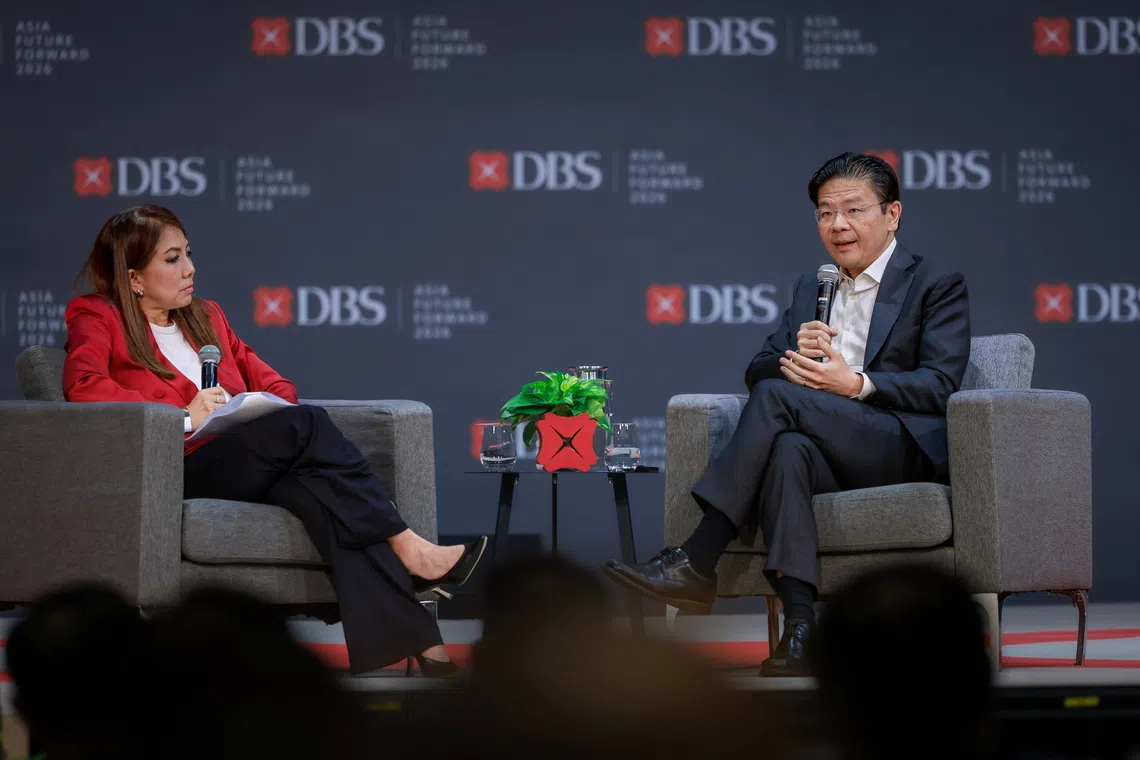 Prime Minister Lawrence Wong (right) participates in a dialogue moderated by DBS Bank CEO Tan Su Shan during the DBS Asia Future Forward Conference at Suntec Convention and Exhibition Centre on Oct 12.