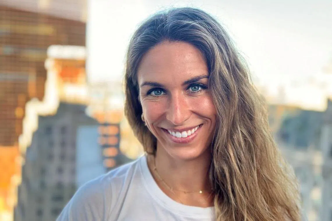 Olympic discus champion Valarie Allman smiles in Manhattan, New York City, U.S., November 13, 2023. REUTERS/Roselle Chen
