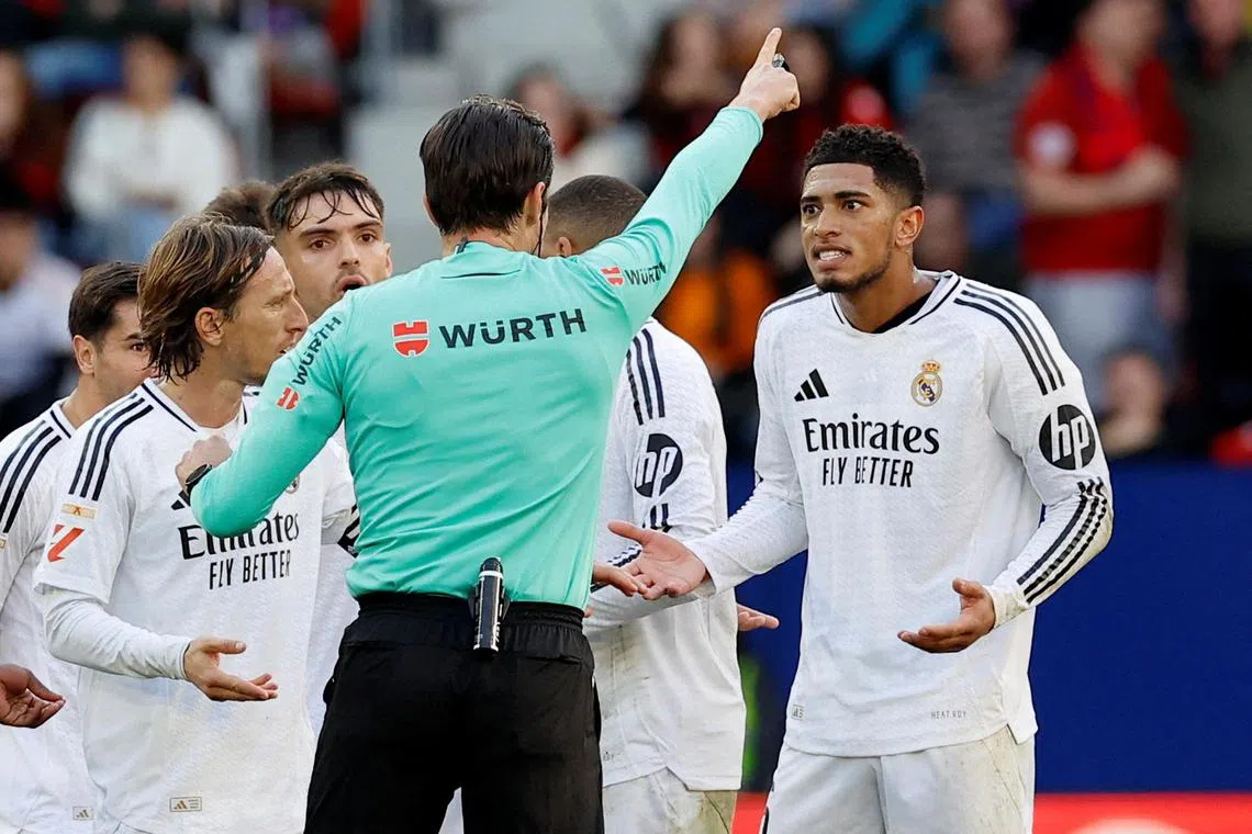 Real Madrid's Jude Bellingham reacts after being shown a red card by referee Jose Munuera in the Spanish La Liga match against Osasuna.