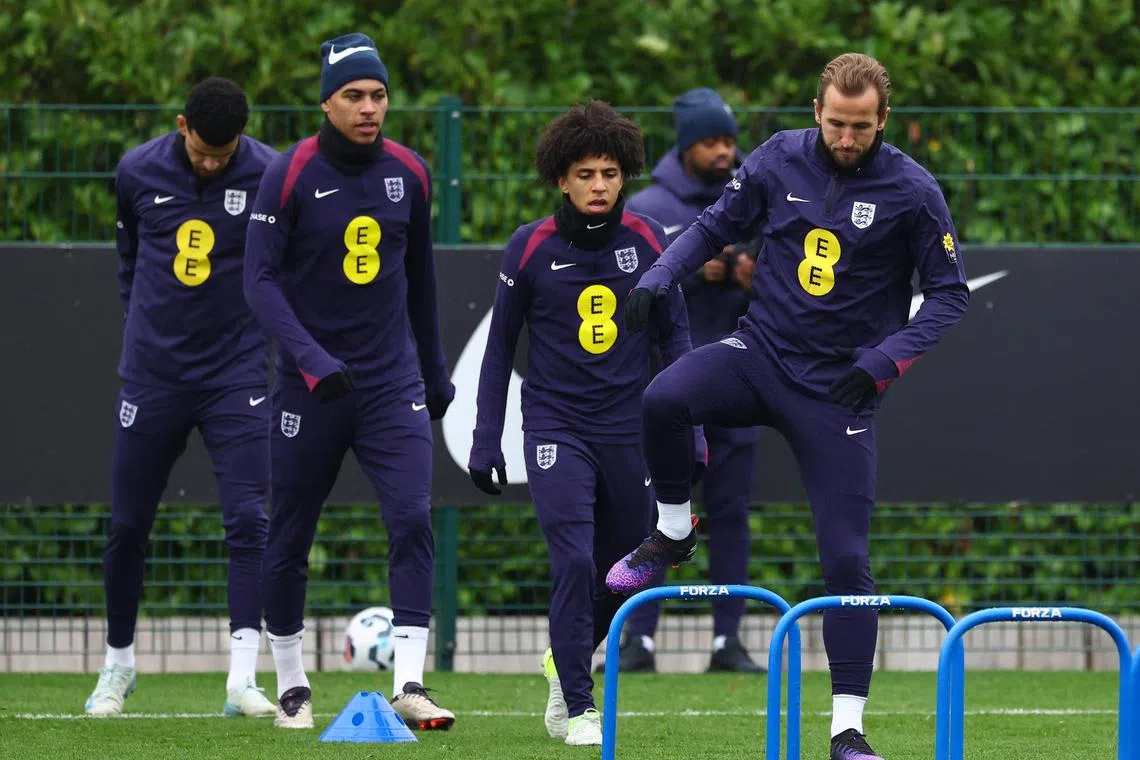 England's Rico Lewis and Harry Kane during training on Nov 16.
