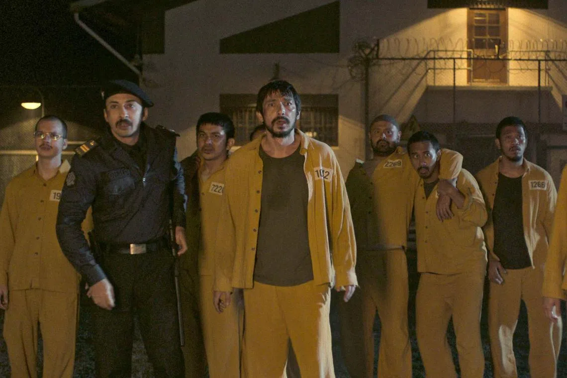 Abimana Aryasatya (foreground, second from left) in the Indonesian horror-comedy Ghost In The Cell.