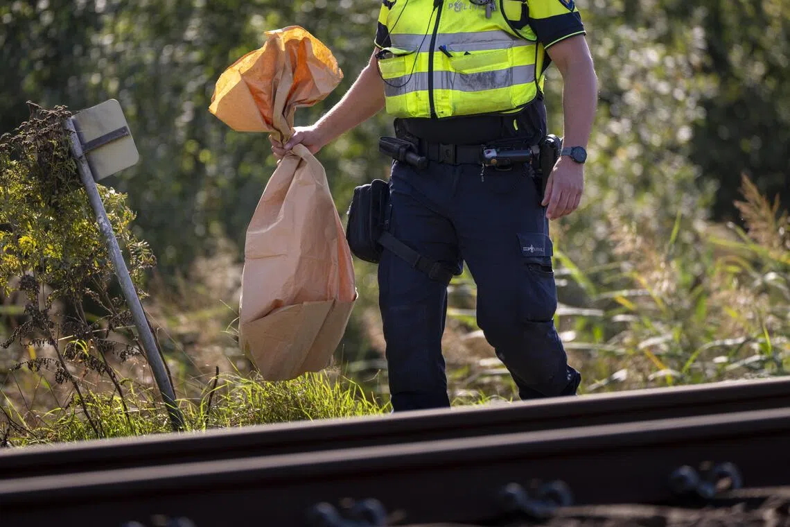 Dutch roads and rail lines blocked as farmers start fires in budget protest